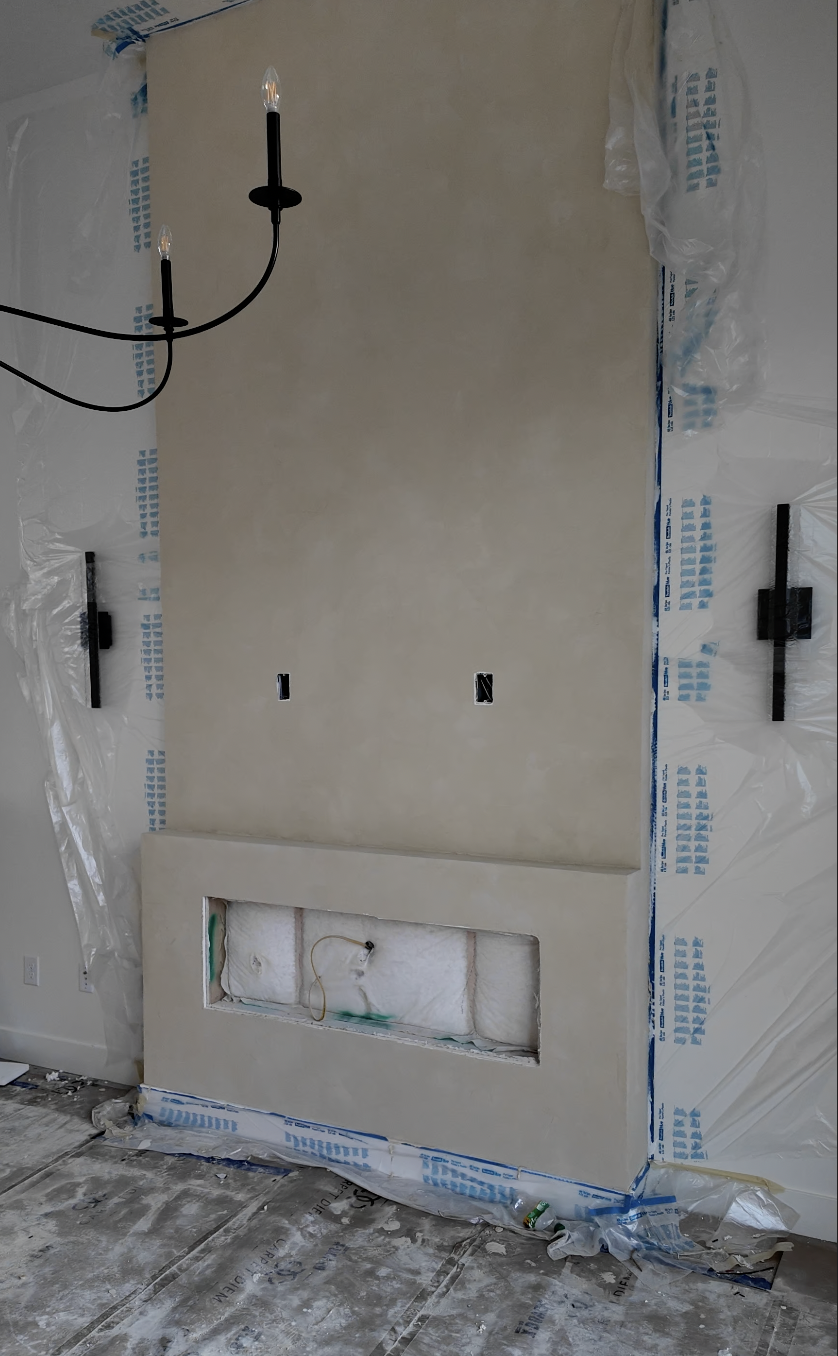 Stucco sand finish fireplace wall in progress